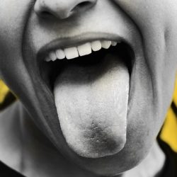 a woman making a funny face with her tongue out