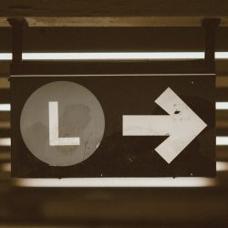 black and white arrow sign